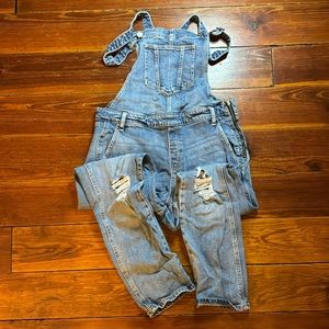 Distressed overalls with side zipper
